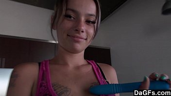 Freckled-face baby pays with her dildo on kitchen counter